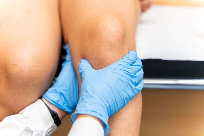 examining knee