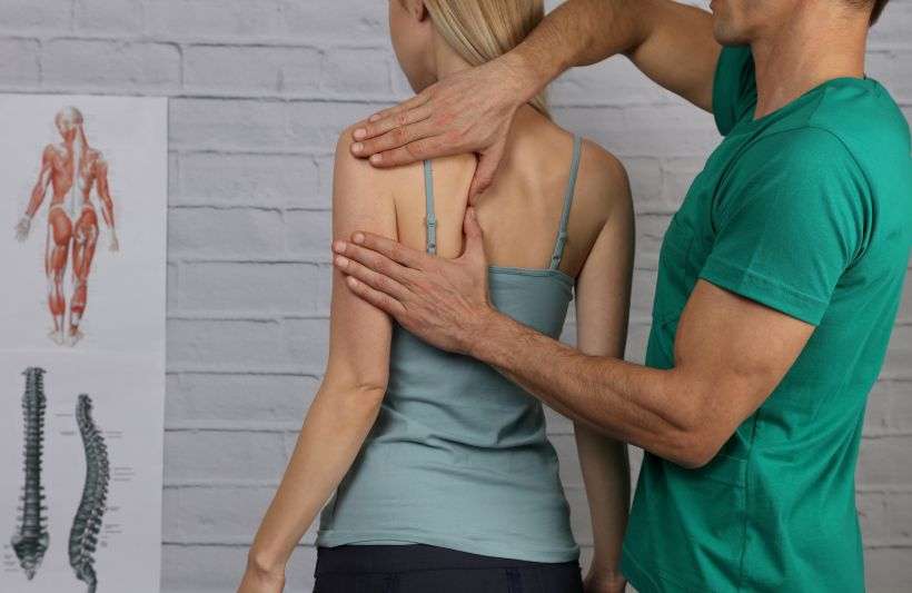 massaging back muscle