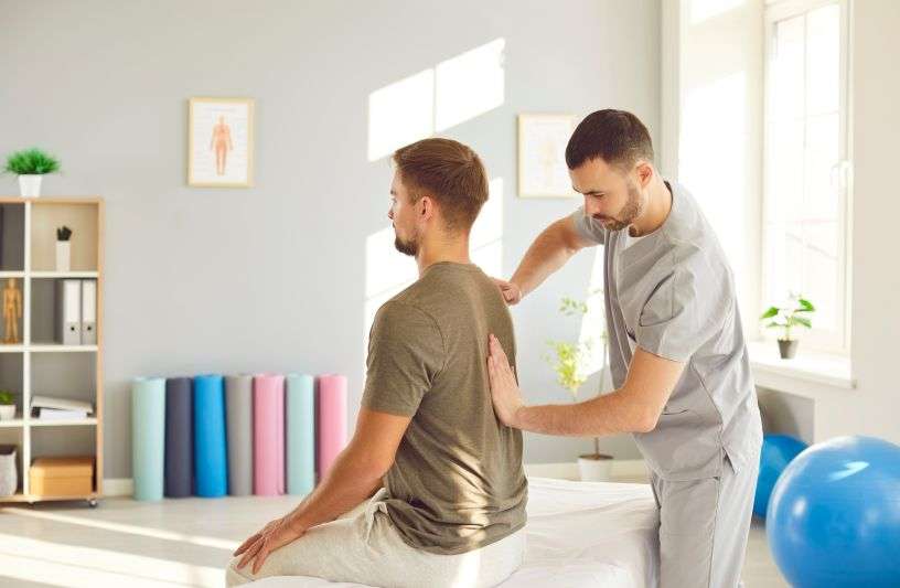 therapist massaging back
