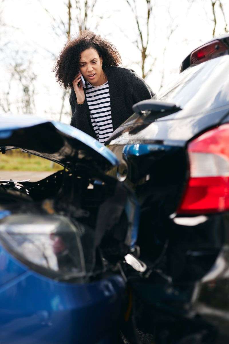 woman phoning car accident